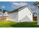 Well-maintained backyard with a shed featuring white siding and a classic gable roof design at 165 Country Gate Ln, Summerville, SC 29485