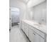 Bright bathroom with double vanity, under sink cabinets and drawers, and marble floors at 165 Country Gate Ln, Summerville, SC 29485
