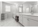 Elegant bathroom with double sinks, vanity seating, and a glass-enclosed shower at 165 Country Gate Ln, Summerville, SC 29485
