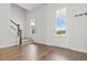 Bright foyer with hardwood floors, staircase, and a glass-paneled front door at 165 Country Gate Ln, Summerville, SC 29485