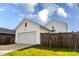 Detached two-car garage with a white garage door, matching white siding and a paved driveway at 165 Country Gate Ln, Summerville, SC 29485