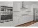 Gourmet kitchen featuring stainless steel appliances, white cabinets, and a gas cooktop at 165 Country Gate Ln, Summerville, SC 29485