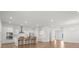 Open-concept kitchen with stainless steel appliances, white cabinetry, and a central island with bar seating at 165 Country Gate Ln, Summerville, SC 29485