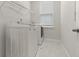 Laundry room featuring washer, dryer, wire shelving, and marble floors at 165 Country Gate Ln, Summerville, SC 29485