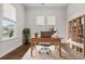 Bright home office with a large window, desk, and stylish built-in shelving at 165 Country Gate Ln, Summerville, SC 29485