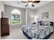 Cozy bedroom with a ceiling fan, bright window, and comfortable bed for a relaxing atmosphere at 169 Historic Dr, Mount Pleasant, SC 29464