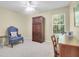 This bright bedroom offers a comfortable chair, an armoire, and a window with views of the outdoors at 169 Historic Dr, Mount Pleasant, SC 29464