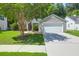 This beautiful single-story home with well-maintained landscaping and an attached two-car garage has great curb appeal at 169 Historic Dr, Mount Pleasant, SC 29464