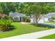 Charming single-story home boasts a well-manicured lawn, mature trees, and inviting curb appeal at 169 Historic Dr, Mount Pleasant, SC 29464