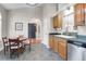 Bright kitchen features tile floor, stainless steel appliances, and breakfast nook seating at 169 Historic Dr, Mount Pleasant, SC 29464