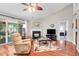 Comfortable living room with hardwood floors, fireplace, and access to patio at 169 Historic Dr, Mount Pleasant, SC 29464