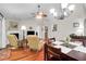 Open-concept living room with hardwood floors, fireplace, and a ceiling fan at 169 Historic Dr, Mount Pleasant, SC 29464