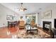 Open living area with hardwood floors, fireplace, and lots of natural light at 169 Historic Dr, Mount Pleasant, SC 29464