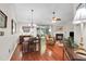 Open-concept living room with hardwood floors, fireplace, and ample natural light from sliding glass doors at 169 Historic Dr, Mount Pleasant, SC 29464