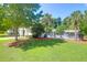 Community pool area offers green space, walking path, and lounging area with chairs and umbrellas at 169 Historic Dr, Mount Pleasant, SC 29464