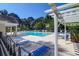 Community pool area features lounge chairs, tables, and a pergola perfect for relaxing and socializing at 169 Historic Dr, Mount Pleasant, SC 29464