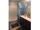 Bathroom featuring a shower and bathtub combo, double sink vanity and white and blue patterned shower curtain at 1720 Restoration Ct, Charleston, SC 29414