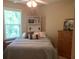 Cozy bedroom featuring natural light, a bed with a padded headboard, and an oak dresser at 1720 Restoration Ct, Charleston, SC 29414