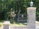View of the brick entrance for BridgeWater at Carolina Bay, showing lush landscaping at 1720 Restoration Ct, Charleston, SC 29414
