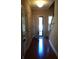 Welcoming entryway with hardwood floors, bright natural light, and convenient access to the home at 1720 Restoration Ct, Charleston, SC 29414