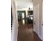 Hallway with hardwood floors connecting living spaces, creating an open and inviting atmosphere at 1720 Restoration Ct, Charleston, SC 29414