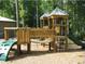 Community playground with climbing structures, slides, and wooded surroundings at 1720 Restoration Ct, Charleston, SC 29414