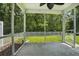 Screened porch with a fan and a view of the backyard at 1720 Restoration Ct, Charleston, SC 29414