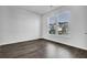 A bright room with hard wood flooring and two large windows at 179 Threaded Fern St, Summerville, SC 29485