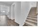 Inviting entryway with hardwood floors, carpeted staircase, and an open floor plan at 179 Threaded Fern St, Summerville, SC 29485