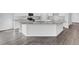 Kitchen island with granite countertops, stainless steel appliances, and white cabinets at 179 Threaded Fern St, Summerville, SC 29485
