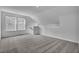 Bright loft area featuring two windows and neutral carpet at 179 Threaded Fern St, Summerville, SC 29485