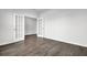 A spacious room featuring hardwood flooring and a pair of French doors at 179 Threaded Fern St, Summerville, SC 29485