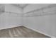 Spacious walk-in closet with ample shelving and neutral carpet at 179 Threaded Fern St, Summerville, SC 29485