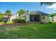 Lush backyard with a screened porch and inviting landscaping at 181 Sea Cotton Cir, Charleston, SC 29412