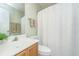 Cozy bathroom features a sink, toilet, and shower with a white shower curtain at 181 Sea Cotton Cir, Charleston, SC 29412