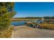 Scenic boat ramp surrounded by lush greenery providing access to calm waters and natural beauty at 181 Sea Cotton Cir, Charleston, SC 29412