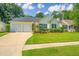 Lovely one-story home with a two-car garage, well-maintained lawn, and a welcoming entrance at 181 Sea Cotton Cir, Charleston, SC 29412