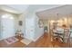 Inviting foyer features hardwood floors, a bench, and opens to the dining area and kitchen at 181 Sea Cotton Cir, Charleston, SC 29412
