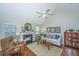 Comfortable living room with fireplace, ceiling fan and hardwood flooring is the perfect place to unwind and enjoy company at 181 Sea Cotton Cir, Charleston, SC 29412