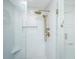 Modern shower with white subway tile, seamless glass door, and gold hardware at 181 Sea Cotton Cir, Charleston, SC 29412