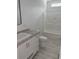 Bright bathroom with a single sink vanity, granite countertops, and a tub-shower combo at 18441 Round O Rd, Round O, SC 29474