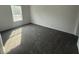 Cozy bedroom with soft carpeting, natural light from the window, and ample space at 18441 Round O Rd, Round O, SC 29474