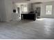 Modern kitchen with stainless steel appliances, white cabinets, and a large island at 18441 Round O Rd, Round O, SC 29474