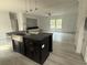 Spacious layout with an island and open floorplan to the living room with lots of natural light at 18441 Round O Rd, Round O, SC 29474