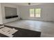 Open living room with plank flooring and a custom entertainment center at 18441 Round O Rd, Round O, SC 29474