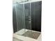 Sleek glass-enclosed shower with a stylish dark tile surround and modern fixtures at 18441 Round O Rd, Round O, SC 29474