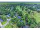 Breathtaking aerial view of a golf course community with mature trees, scenic water features, and luxury homes at 195 Prestwick Ct, Summerville, SC 29483