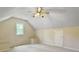 Finished attic space featuring carpeted floors, dormer window, and additional storage at 195 Prestwick Ct, Summerville, SC 29483
