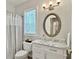 Well-lit bathroom features gray and white finishes, vanity with marble countertop, and shower with curtains at 195 Prestwick Ct, Summerville, SC 29483