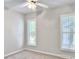 Well-lit bedroom with carpet, ceiling fan, and bright windows at 195 Prestwick Ct, Summerville, SC 29483